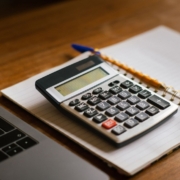 Accounting laptop calculator — Pexels Calculator and financial documents illustrating the cost of extended customer payment terms
