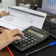Business calculation with financial documents — Bia Limova / Pexels Person calculating project costs using a calculator and financial documents at a desk