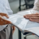 Business professionals reviewing documents together during a pricing and financial planning discussion