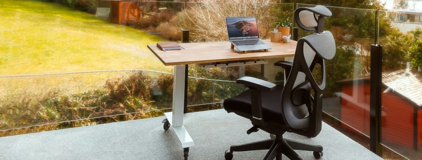 Empty office chair with laptop representing a planned new employee hire