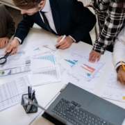 Business team reviewing financial plans and investment documents
