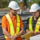 Contractors using technology at a jobsite representing Contractor+ field-service software