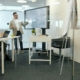 Executive presenting financial strategy and investment analysis to colleagues in a boardroom