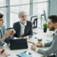 Finance leaders discussing forecasts in a meeting