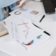 Financial charts on desk