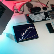 Laptop and financial analysis workspace illustrating an Excel financial forecast model
