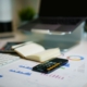 Financial reports and calculations on a desk illustrating accounts receivable collections forecasting