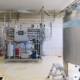 Industrial manufacturing equipment inside a modern factory, illustrating a lease versus buy equipment decision