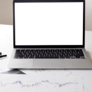 Laptop and financial documents on desk – landscape Pexels photo by Hanna Pad Laptop and financial paperwork on an office desk for reviewing SaaS software subscription renewal budgets