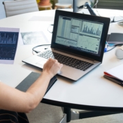 Operating expense forecasting Financial charts and laptop used for operating expense forecasting