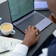 Finance professional reviewing financial charts and working capital data on a laptop