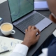 Finance professional reviewing financial charts and working capital data on a laptop