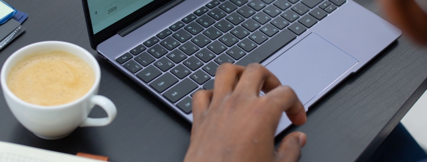 Finance professional reviewing financial charts and working capital data on a laptop